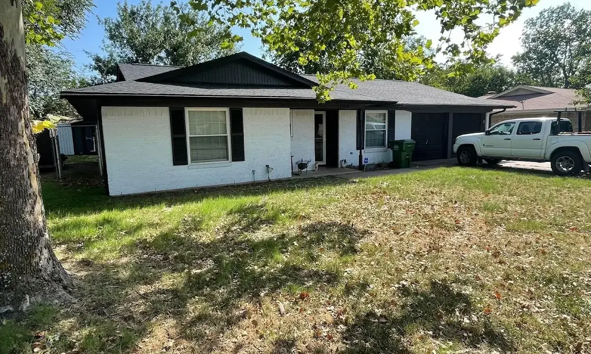 Professional roofing crew working on a residential roof in Silverton